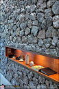 Inset display shelf in rock wall with downlighting. Iconic stone walls at X2 Kui Buri resort Thailand: 
