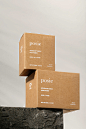 Stacked brown kraft candle boxes by Australian brand Posie