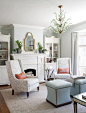 Elegant formal medium tone wood floor living room photo in San Francisco with blue walls and a standard fireplace