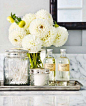 simple bathroom vignette - love random bottles & jars as storage .: 