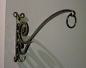 Beautiful forged plant hangers. By Gene Fahn.