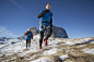 Photograph Caucasian hikers jogging in snowy landscape by Gable Denims on 500px