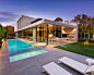 Photo of a large modern back rectangular lengths swimming pool in Melbourne with concrete slabs and a hot tub. — Houzz