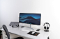black flat widescreen computer monitor with with Apple Magic Keyboard and mouse on desk