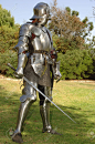 7060301-mediaeval-knight-in-shining-armour-of-the-15th-century-standing-outside-with-sword.jpg (863×1300)