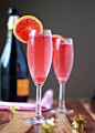 Blood Orange and Pomegranate Champagne Cocktails - Tart, juicy, and so happy, the pomegranate arils dance in the bubbles!