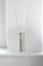 Polished Concrete Necklace DIY - Learn How to Make a Minimalist and Modern Concrete Necklace in this jewelry  tutorial. You will need cement, cardstock..: 