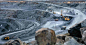 A large mine with machinery from above.