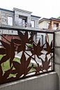 Laser cut 'Maple' fence infills (with 'Maple' balustrade feature panes in the background). Designed & constructed by Entanglements metal art