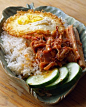 Nasi Lemak    Fried egg, sambal sotong cooked in lemon grass and cucumber on nasi lemak