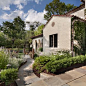 Photo of a mid-sized mediterranean front yard stone garden path in DC Metro.