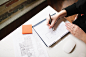 Businesswoman writing in notebook. by EasyPx on 500px