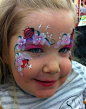 Face painting little lady bug with flowers