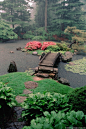 Japanese garden with island and bridge.