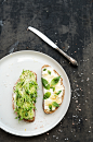 Avocado, ricotta, basil and sprout sandwiches on white ceramic plate over dark grunge backdrop, top  by Anna Ivanova on 500px