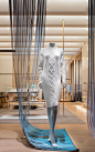 1436 | Gabellini Sheppard : Boutique Retail, Showcase, Retail, Branding, Beijing, China, Kerry Center, Flagship Store, vertical panels, LED lights, glass facade, natural light, suspended shelving, merchandise, illuminated veiled plaster ceiling panels, in