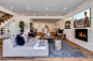 Inspiration for a large modern open concept medium tone wood floor living room remodel in Los Angeles with a standard fireplace, a tile fireplace and a wall-mounted tv