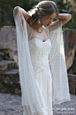 #礼服婚纱设计欣赏#简洁的设计，因婚纱上的立体“花”而倍添柔美；在质朴的设计中，华丽的“披肩”彰显别出心裁的设计，女子们，你喜欢么？