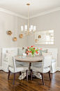 Example of a transitional medium tone wood floor and brown floor breakfast nook design in Orlando with gray walls and no fireplace