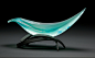 Elliptical Vessel in Lagoon and Aqua by Brian Russell (Art Glass Sculpture) | Artful Home : Elliptical Vessel in Lagoon and Aqua by Brian Russell. A dramatic crest of aqua glass with shifting blues rests on a forged steel base of graceful arcs. The colors