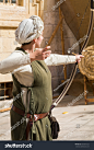 stock-photo-young-woman-dressed-in-traditional-ancient-medieval-clothing-costume-aiming-bow-with-arrow-towards-660267232.jpg (1001×1600)