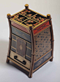 cabinet in the form of oi monks backpack, each corner supported by a d