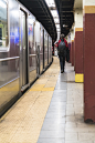 Young woman walking on the trainstation in Manhattan subway