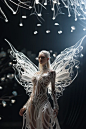 a live female full body model was dressed 3D virtual costume design inspired by butterfly stand in futuristic garden scene of electric flower, 3d printed clothing, Van Herpen, liquid material，bone sturcture,hyper-realistic clothing,high-definition renderi