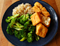 Brown rice, steamed broccoli with nutritional yeast, and deep-fried tofu with soy sauce.