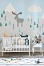 Transform your kid's bedrooms with one of these mountain wall murals. Adorable woodland animals are nestled amongst the pastel mint trees and snowy mountains. The neutral colours work a dream in bright and modern nursery spaces.