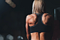 woman wearing black sports bra facing front selective focus photography