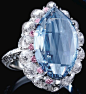 Fancy vivid blue diamond ring with pink and white diamonds.  The center stone is an extremely rare modified pear double rose-cut fancy vivid blue diamond weighting 5 carats. The blue diamond is surrounded by 6.69 carats of briolette diamonds and brilliant