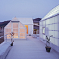 House in Yamasaki with rooftop sheds by Tato Architects