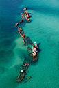 Moreton Bay / Queensland, Australia.  Fifteen vessels have been deliberately sunk on the landward side of Moreton Island to form a breakwall for small boats and a wreck dive and snorkel site. Even in this shallow water, the wrecks attract an amazing amoun