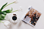 1 Teacup With Saucer and Magazine on White Surface