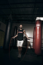 Male boxer training on skipping rope in gym