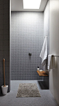 Shower with grey tiling: