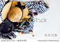Top view of summer accessories for modern woman on her vacation. Straw hat, camera, stylish sunglasses, black leather boho bag and striped beach dress on white floor. -物体,美容/时装服饰-海洛创意（HelloRF） - 站酷旗下品牌 - Shutterstock中国独家合作伙伴