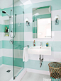 Aqua-and-white striped bathroom. Design: Angela Free