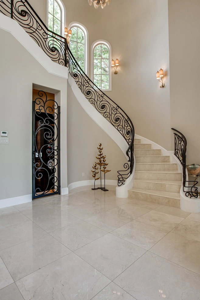 This is an example of a mediterranean curved metal railing staircase in ...