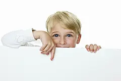 Boy pointing to copy space