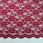 Enchanting Nylon Lace - Gypsy  Red : Nylon floral lace in gypsy red. About this Fabric: This 100% nylon lace is in a floral rose pattern that can be used in any occasion. It has many textures and made with a shinny and dull yarn to create a dimensional fl