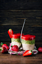 three-layer-smoothie-from-banana-kiwi-and-strawberry-on-a-wooden-background