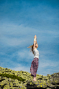 Woman doing yoga exercise on fresh air with blue sky on backgrou by Dmytro Gilitukha on 500px