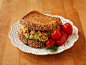 Chickpea salad sandwich (chickpeas, vegan mayo, dill, mustard, pickles, green bell pepper, carrot, red onion, salt & pepper) with spinach on toasted sprouted grain bread and grape tomatoes.