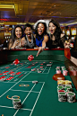 Gable Denims在 500px 上的照片Excited friends gambling at craps table in casino