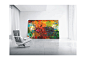 A large oil painting and chair is in the room.