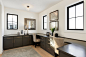 Transitional built-in desk light wood floor home office photo in Minneapolis with white walls