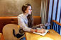 Girl playing guitar at cafe Premium Photo