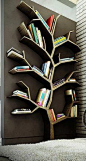 Book tree - functional art! ... cool feature wall for the library/ study/ storage room just off our main entrance - could see this feature wall through the double glass doors ... maybe attach or embed miniature lights along the wood branches so would twin